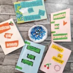 Copii entuziaști lucrează la propriile jurnale de vacanță la o atelier din Biblioteca ASTRA Sibiu.