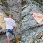 Graffiti sub forma unei inimi cu numele ‘Anna’ pe peretele muntos de pe Transfăgărășan, considerat vandalism.